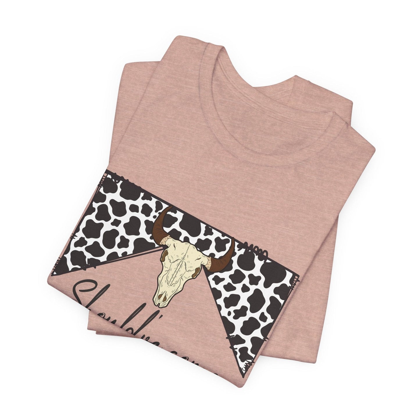 hope + joy collective folded heather prism peach short sleeve t-shirt with a graphic image of a leopard banner and cow skull in the middle that says "Should've Come with a Warning" in western font