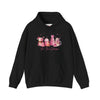 hope + joy collective black hoodie sweatshirt with "Tis the Season" in cursive font below a graphic image of seasonal coffee and cocoa drinks accented in pink with a pink Christmas tree topped with pink bow