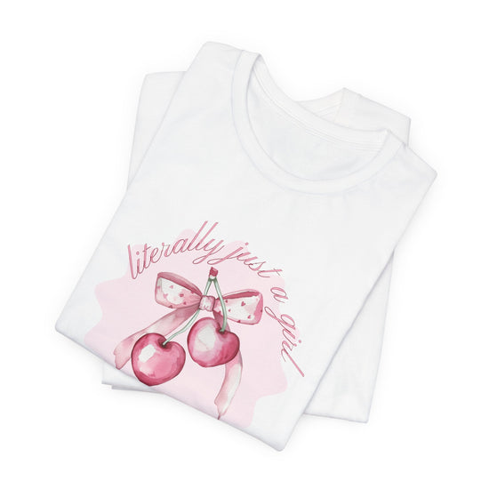 hope + joy collective white short sleeve t-shirt folded with image of pink cherries with pink bow that says "literally just a girl, super sweet, super chic"