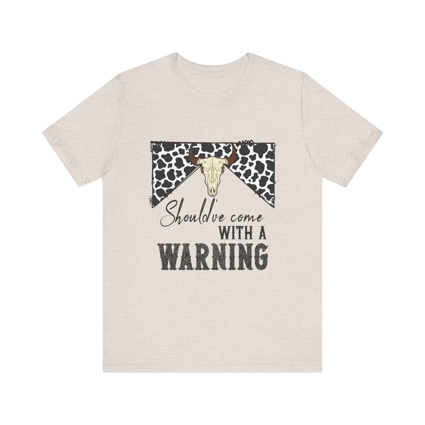 hope + joy collective heather dust short sleeve t-shirt with a graphic image of a leopard banner and cow skull in the middle that says "Should've Come with a Warning" in western font