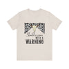 hope + joy collective heather dust short sleeve t-shirt with a graphic image of a leopard banner and cow skull in the middle that says "Should've Come with a Warning" in western font