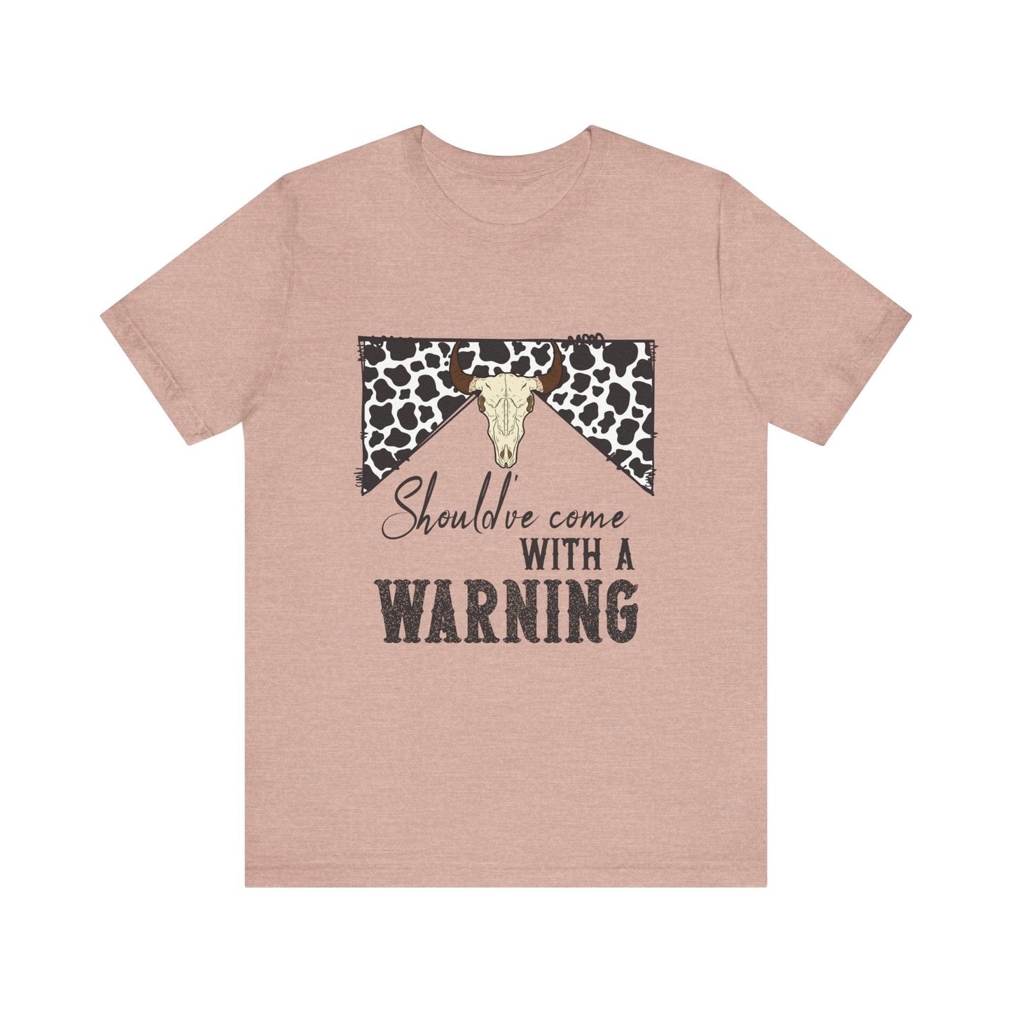 hope + joy collective heather prism peach short sleeve t-shirt with a graphic image of a leopard banner and cow skull in the middle that says "Should've Come with a Warning" in western font