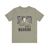 hope + joy collective heather stone short sleeve t-shirt with a graphic image of a leopard banner and cow skull in the middle that says "Should've Come with a Warning" in western font