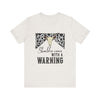 hope + joy collective heather vintage white short sleeve t-shirt with a graphic image of a leopard banner and cow skull in the middle that says "Should've Come with a Warning" in western font